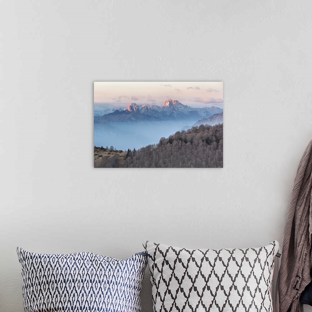 A bohemian room featuring Europe, Italy, Veneto, Treviso, Cansiglio. View towards the Dolomites from mount Pizzoc at sunset.