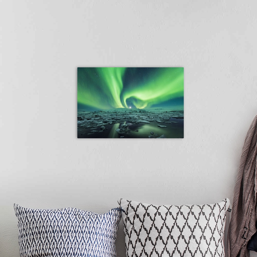 A bohemian room featuring Jokulsarlon, East Iceland, Iceland. Northern lights over the glacier lagoon.
