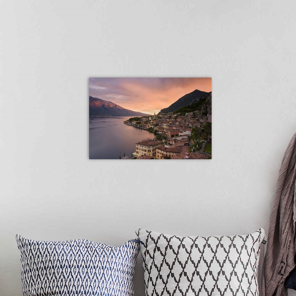 A bohemian room featuring Limone sul Garda at sunset, Garda lake, Brescia province, Lombardy district, Italy, Europe.