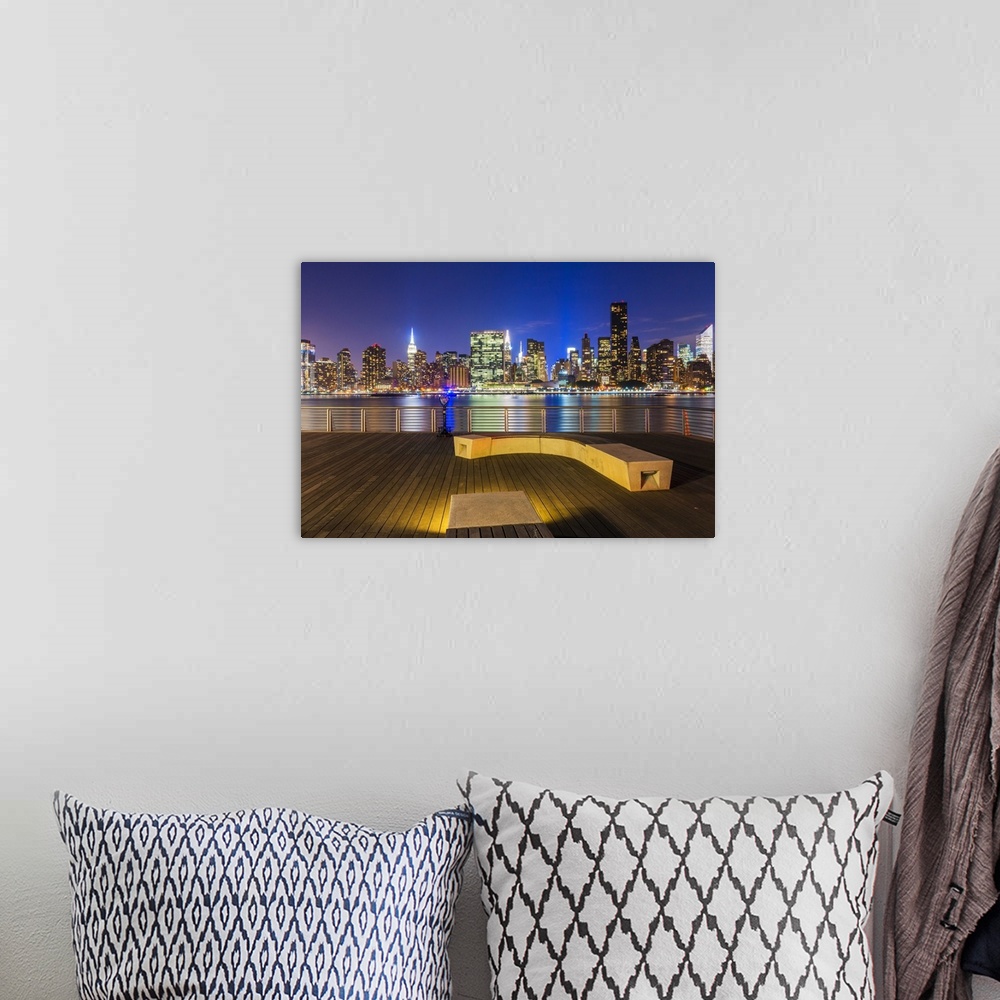 A bohemian room featuring Manhatten skyline at dusk from Gantry Plaza, New York, USA.