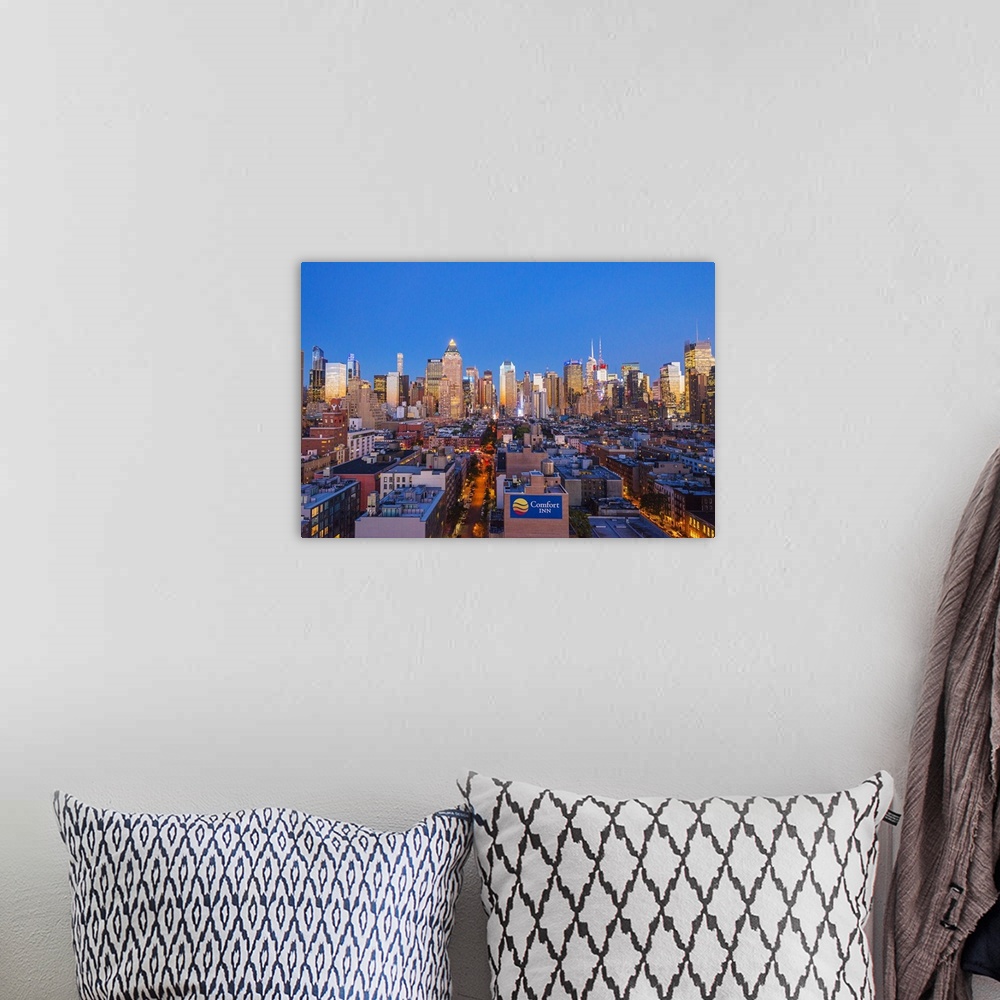A bohemian room featuring View of Midtown Manhattan from the press lounge rooftop bar, New York, USA.