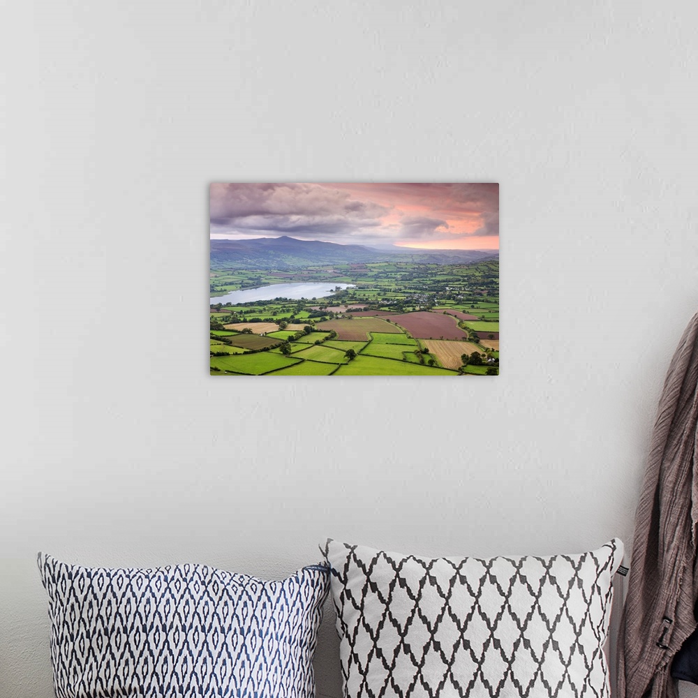 A bohemian room featuring Pink sunset above the Brecon Beacons mountain range and rural countryside near Llangorse, Brecon ...