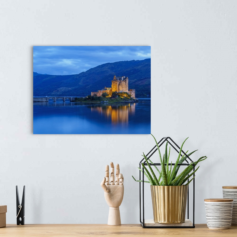 A bohemian room featuring UK, Scotland, Highlands, Dornie, Twilight view of the Eilean Donan Castle.