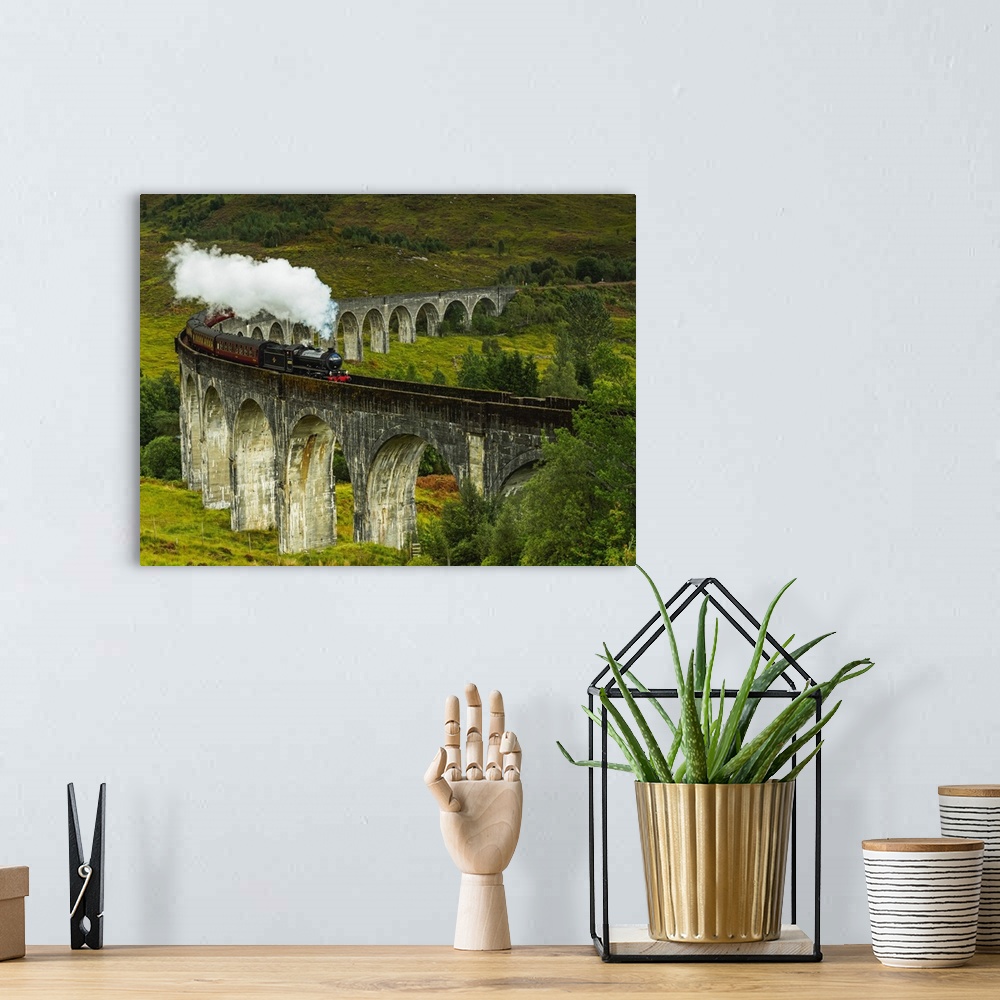 A bohemian room featuring UK, Scotland, Highlands, Jacobite Steam Train crossing the Glenfinnan Viaduct.