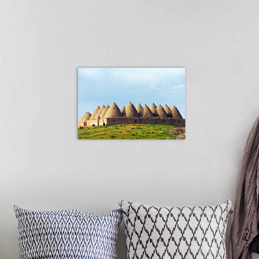 A bohemian room featuring Turkey, Eastern Anatolia, village of Harran, beehive mud brick houses.