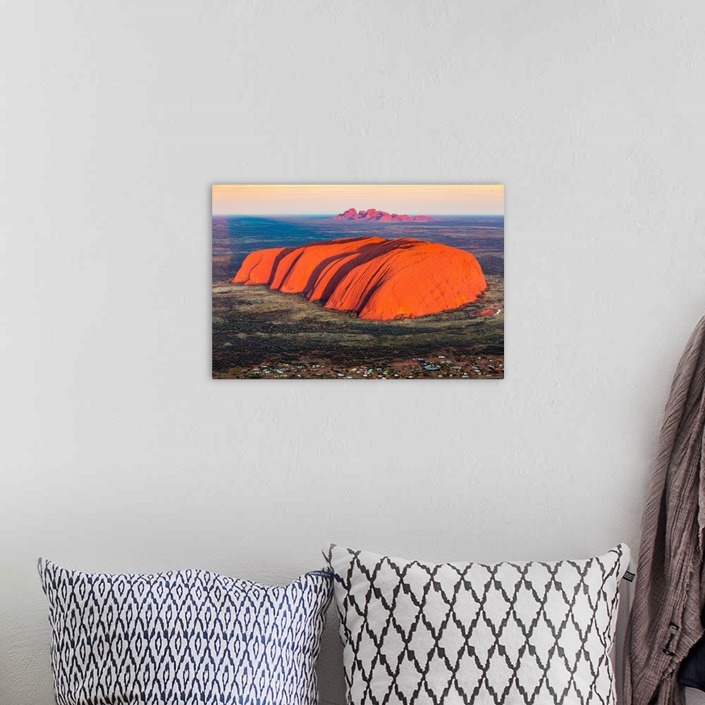 A bohemian room featuring Uluru and Kata Tjuta at sunrise, Aerial view. Northern Territory, Australia.