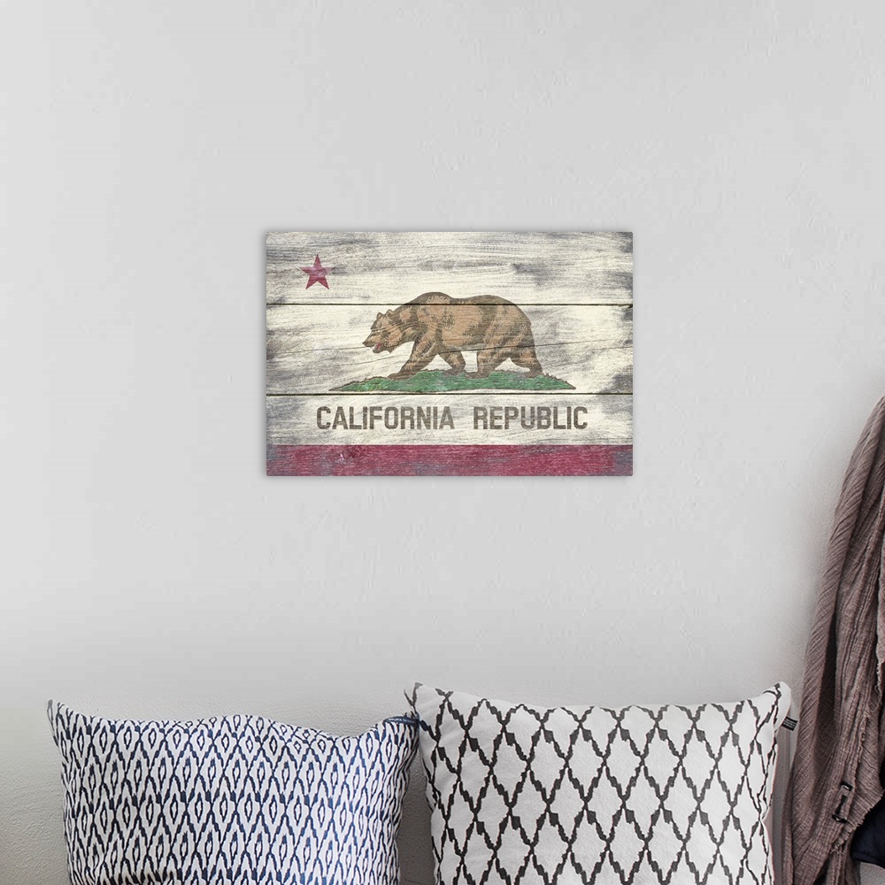 A bohemian room featuring The flag of California with a weathered wooden board effect.