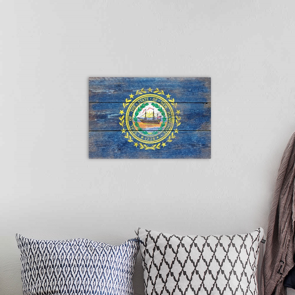 A bohemian room featuring The flag of New Hampshire with a weathered wooden board effect.