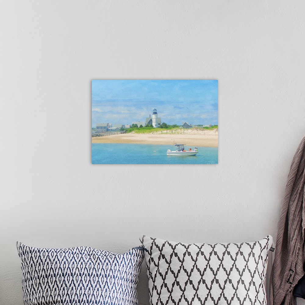 A bohemian room featuring A lighthouse on the beach with a boat on the water in New England.