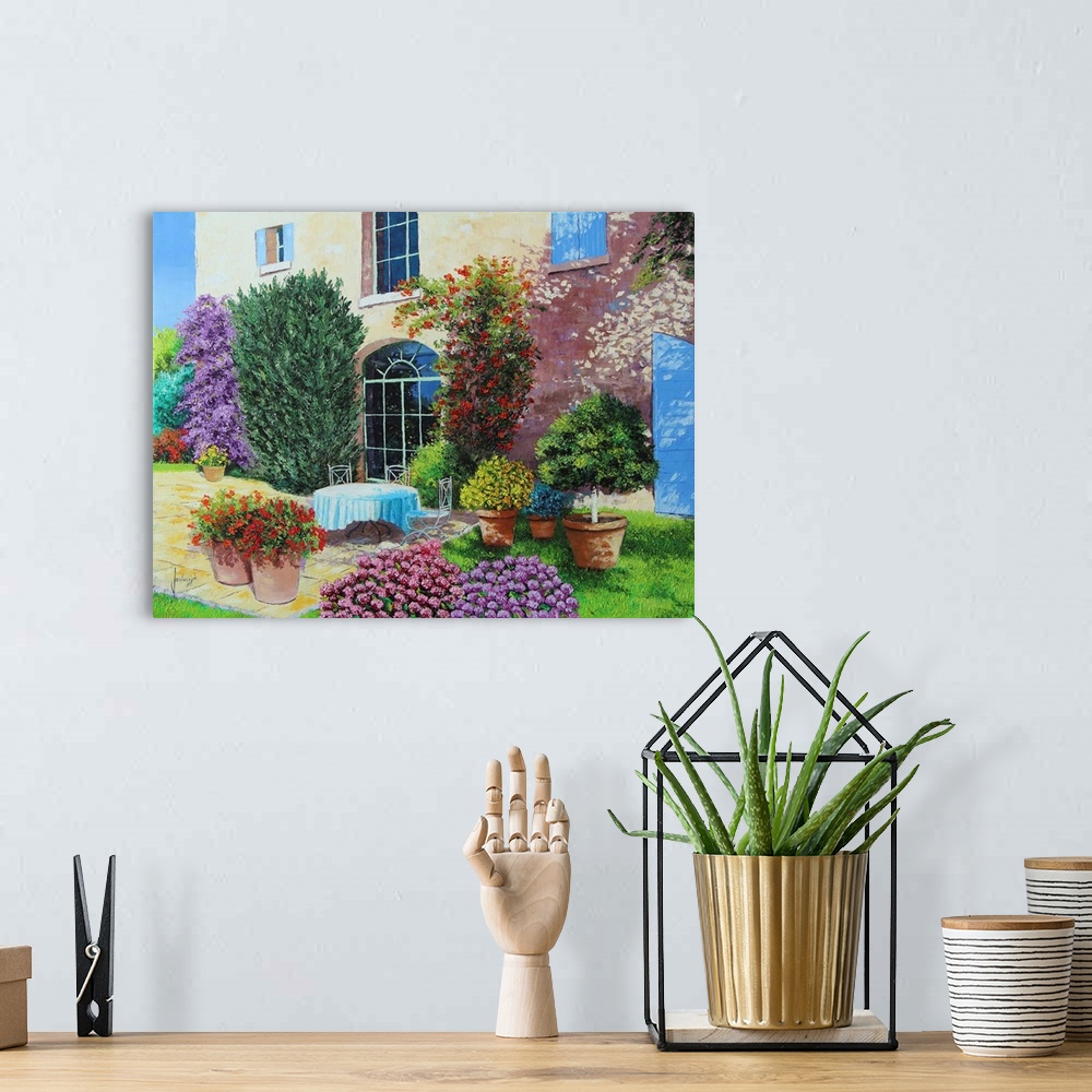 A bohemian room featuring Colorful contemporary painting of a house surrounded blooming flowers and foliage.