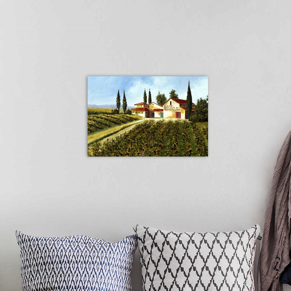 A bohemian room featuring Big painting of grape fields and a large compund on a clear, sunny day.
