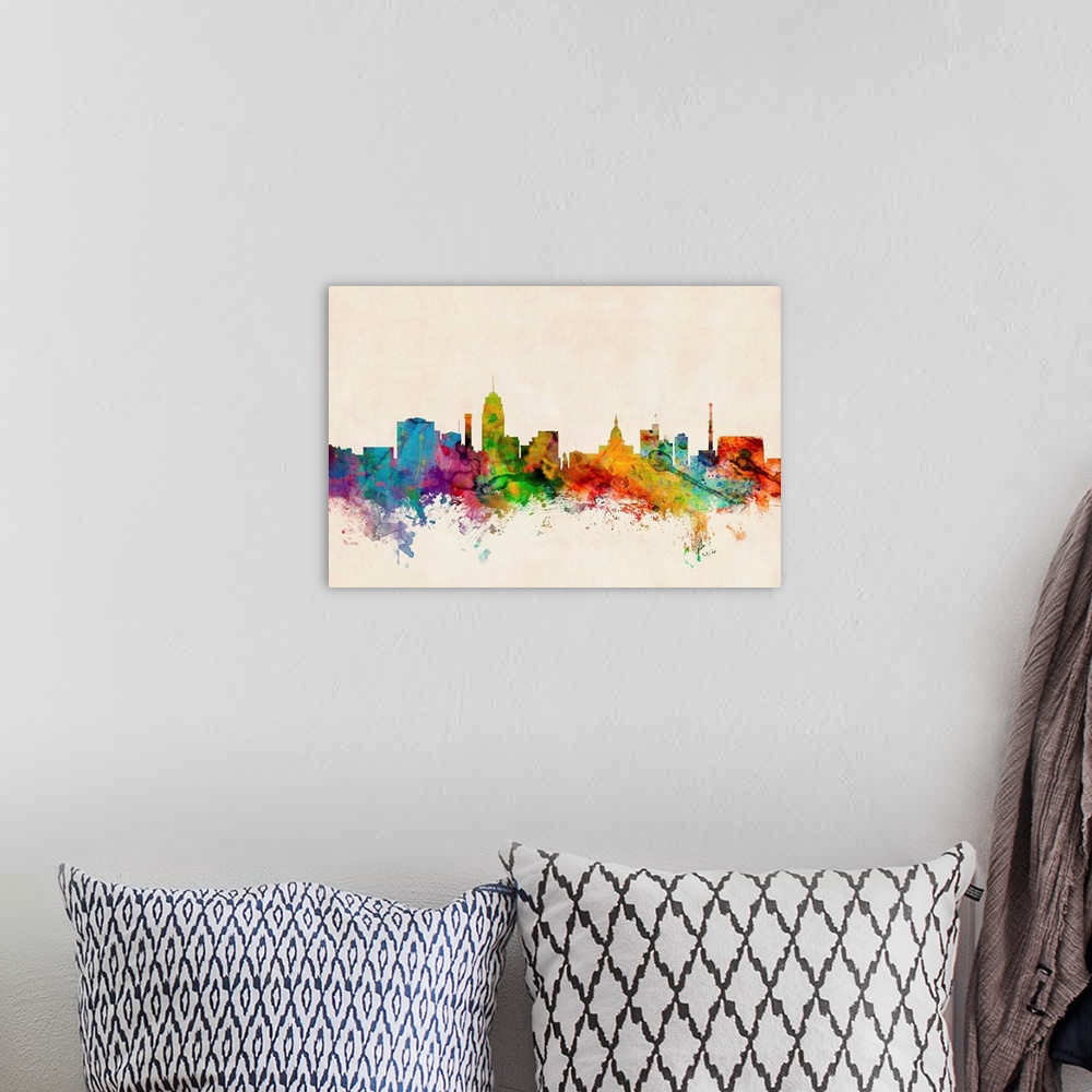 A bohemian room featuring Contemporary piece of artwork of the Lansing skyline made of colorful paint splashes.