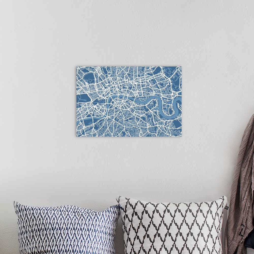 A bohemian room featuring A big map of London showing the network of roads, streets and waterways on canvas.