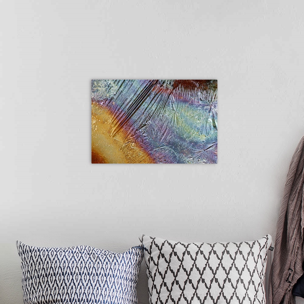 A bohemian room featuring Photograph of grease on top of a piece of rippled foil creating multicolored bands of color.