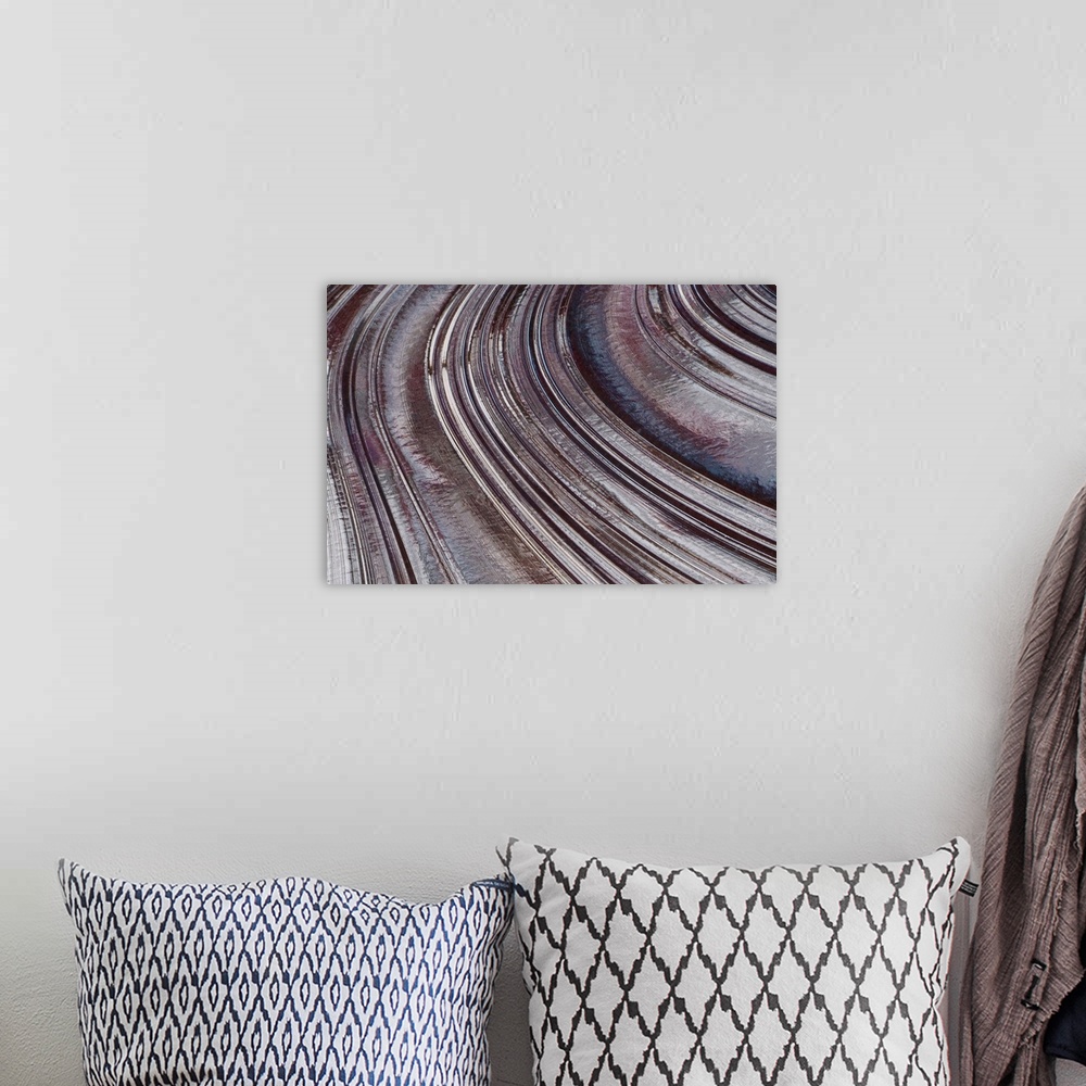 A bohemian room featuring Abstract photo on canvas of curving indentions.