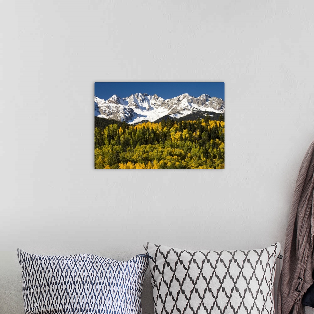 A bohemian room featuring Fall colors and snow covered peaks, North America