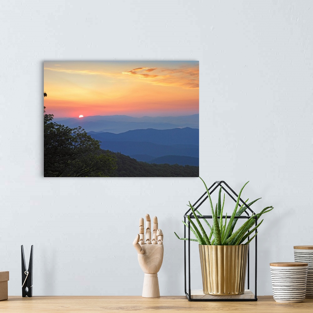 A bohemian room featuring Photo of the sun setting over the mountains from the Blue Ridge Parkway in North Carolina.