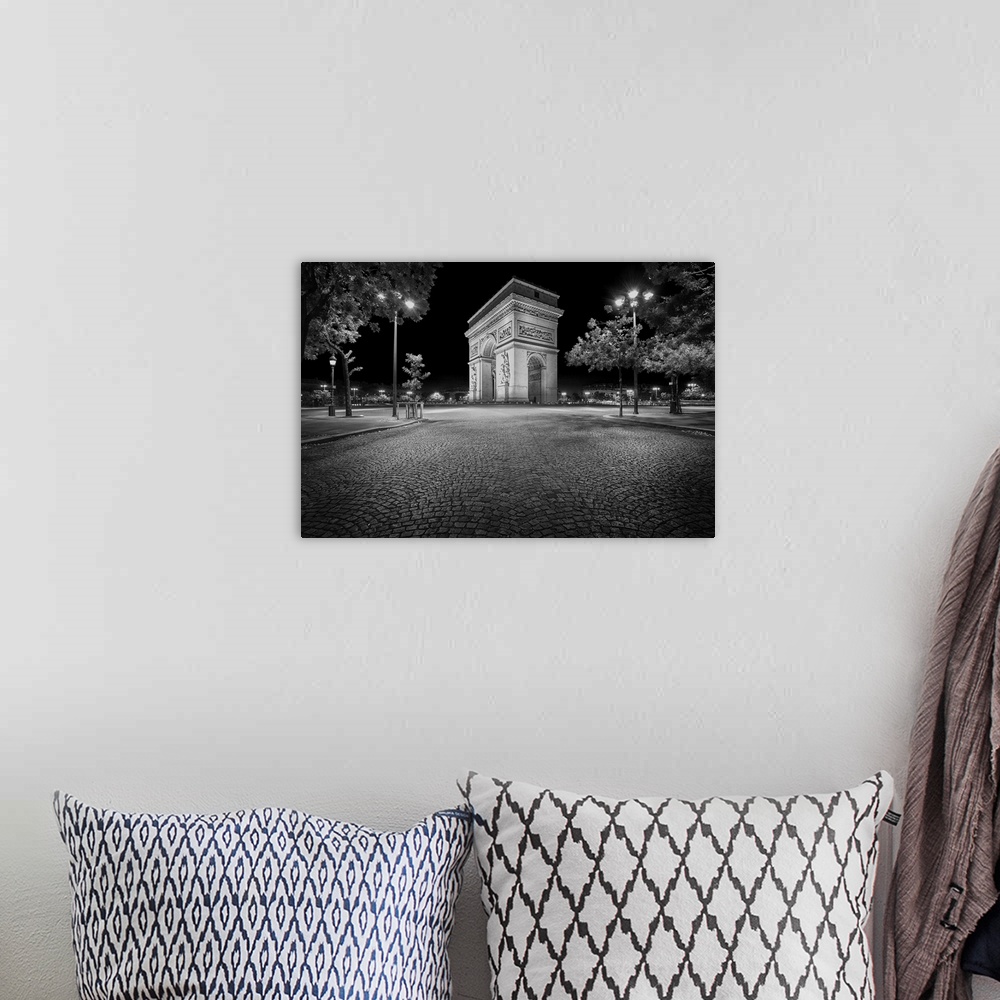 A bohemian room featuring Fine art photo of the Arc de Triomphe, a landmark on the Champs Elysees in Paris.