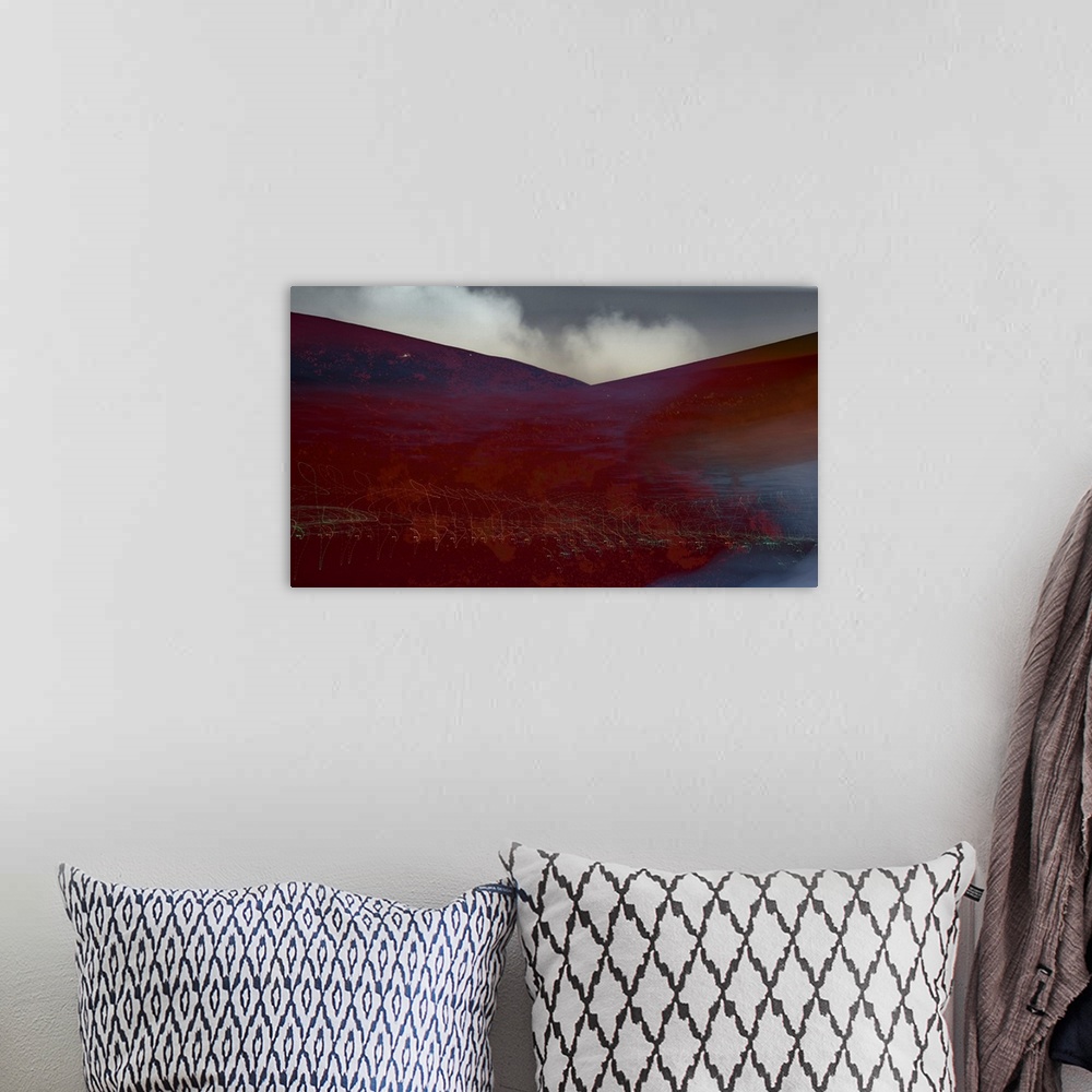A bohemian room featuring Photograph of an abstract landscape with rusted red hills and light trails, created with multiple...