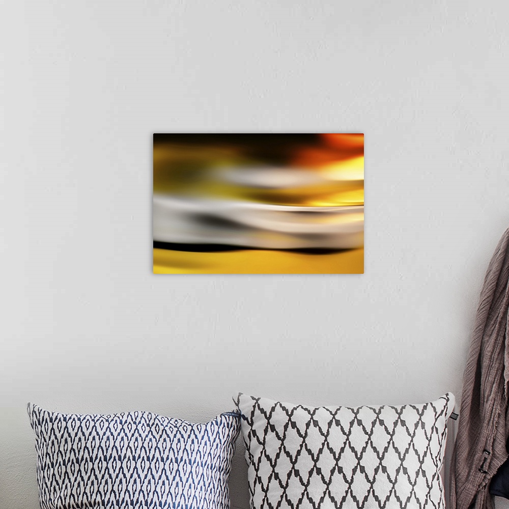 A bohemian room featuring Abstract image of a golden glow at sunset.