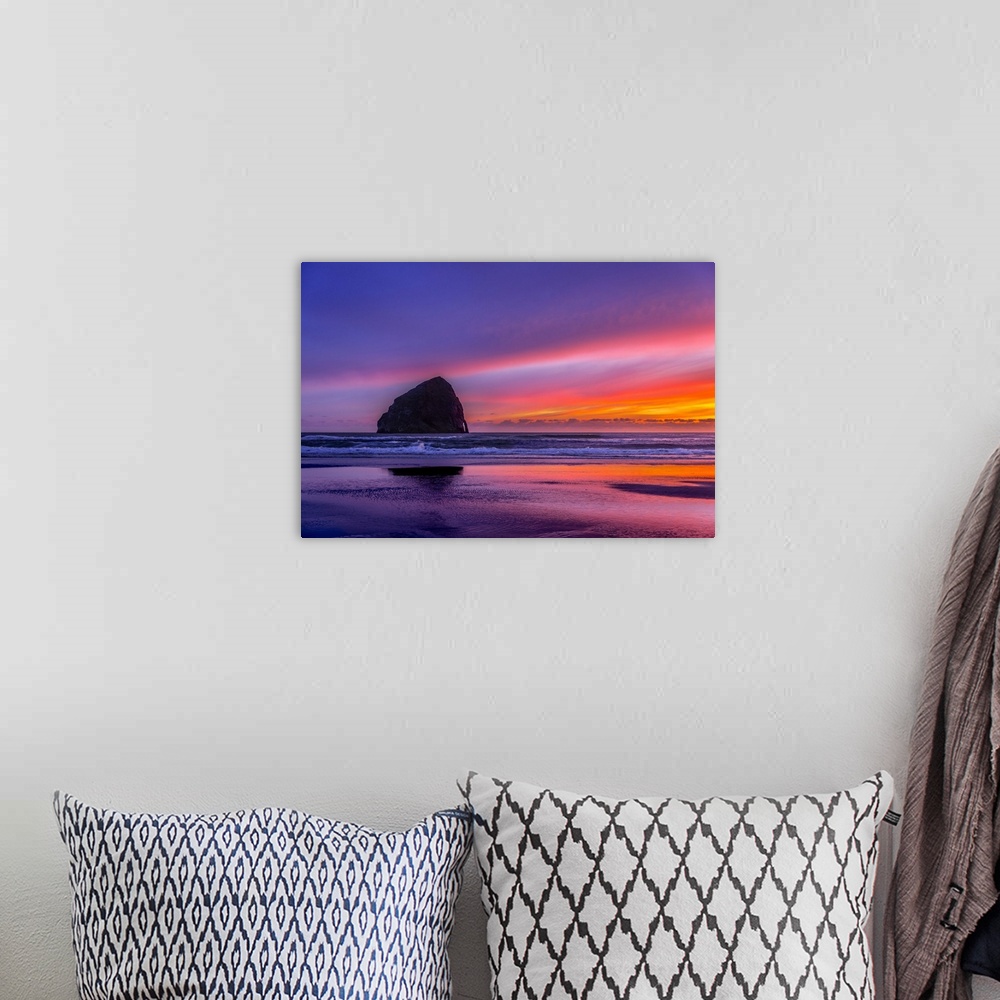 A bohemian room featuring Vibrant purple sunset over Haystack Rock on the Oregon coast.