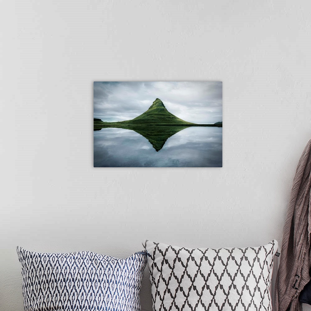 A bohemian room featuring Fine art photograph of the tall peak of Kirkjufell overlooking a calm lake in Iceland.