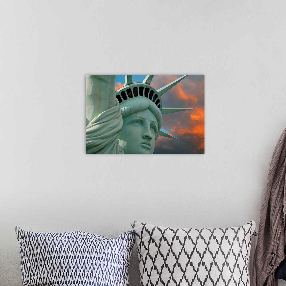 A bohemian room featuring Artistic photograph of the face and crown of the Statue of Liberty in New York with a stunning su...