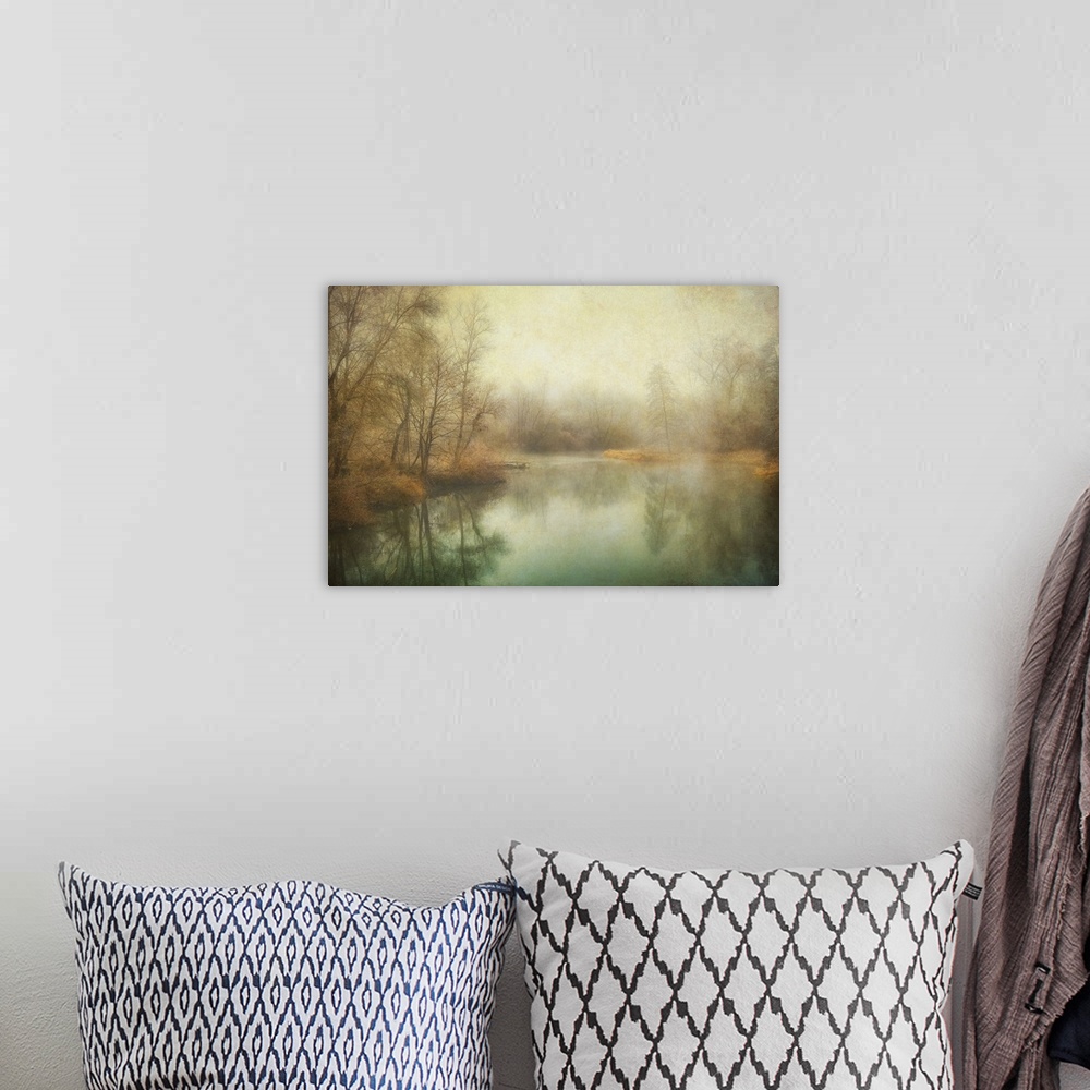 A bohemian room featuring Antique style photograph of winter trees lining a calm body of water.