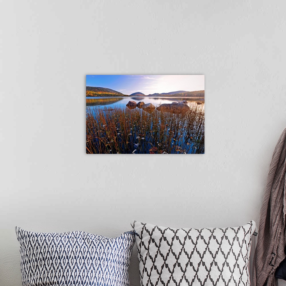 A bohemian room featuring This large piece is a photograph taken over a large body of water with a scenic view of hills in ...