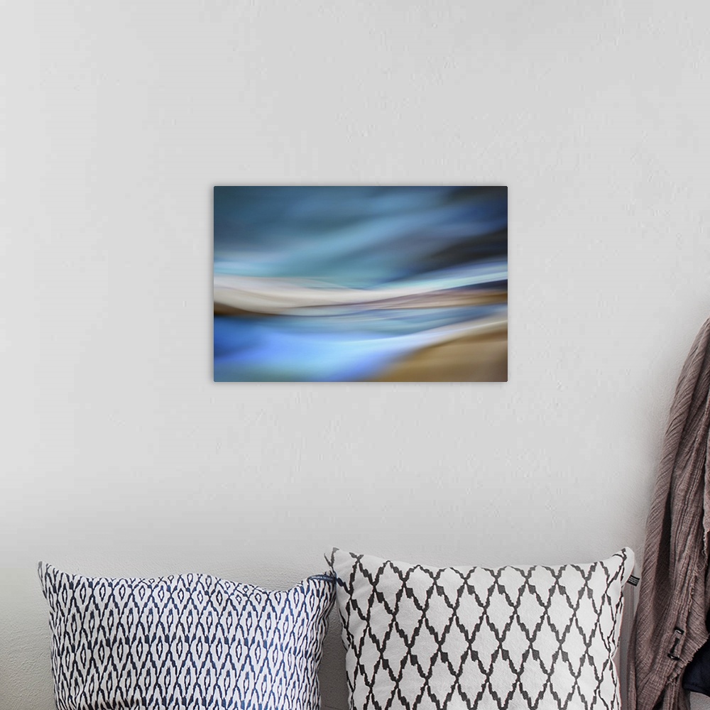 A bohemian room featuring Abstract interpretation of being on a sandy beach by the ocean, on a blue day.