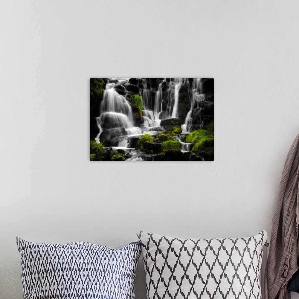 A bohemian room featuring Fine art photo of a waterfall over several round rocks
