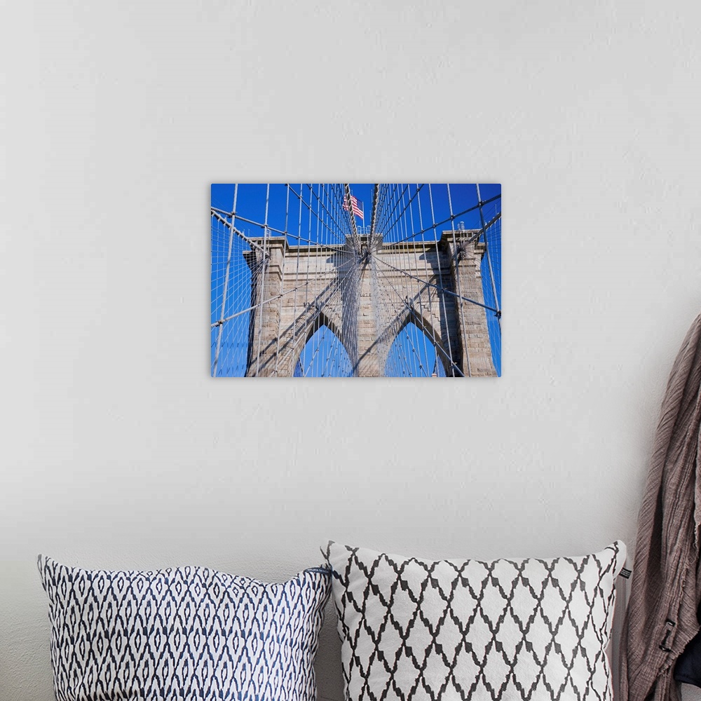 A bohemian room featuring American flag flying over Brooklyn Bridge, New York City, New York