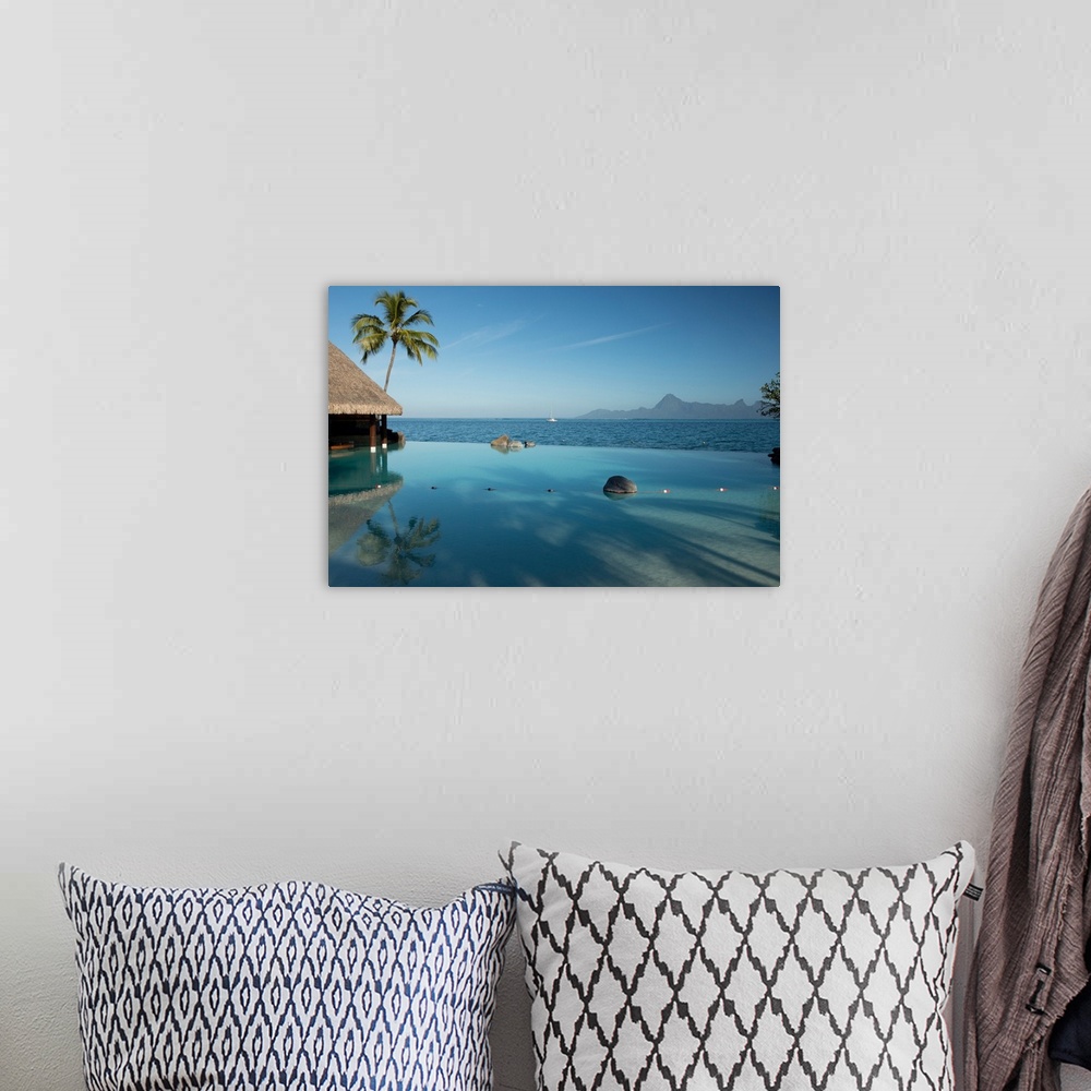 A bohemian room featuring Bungalows and palm trees on the coast, Bora Bora, Society Islands, French Polynesia