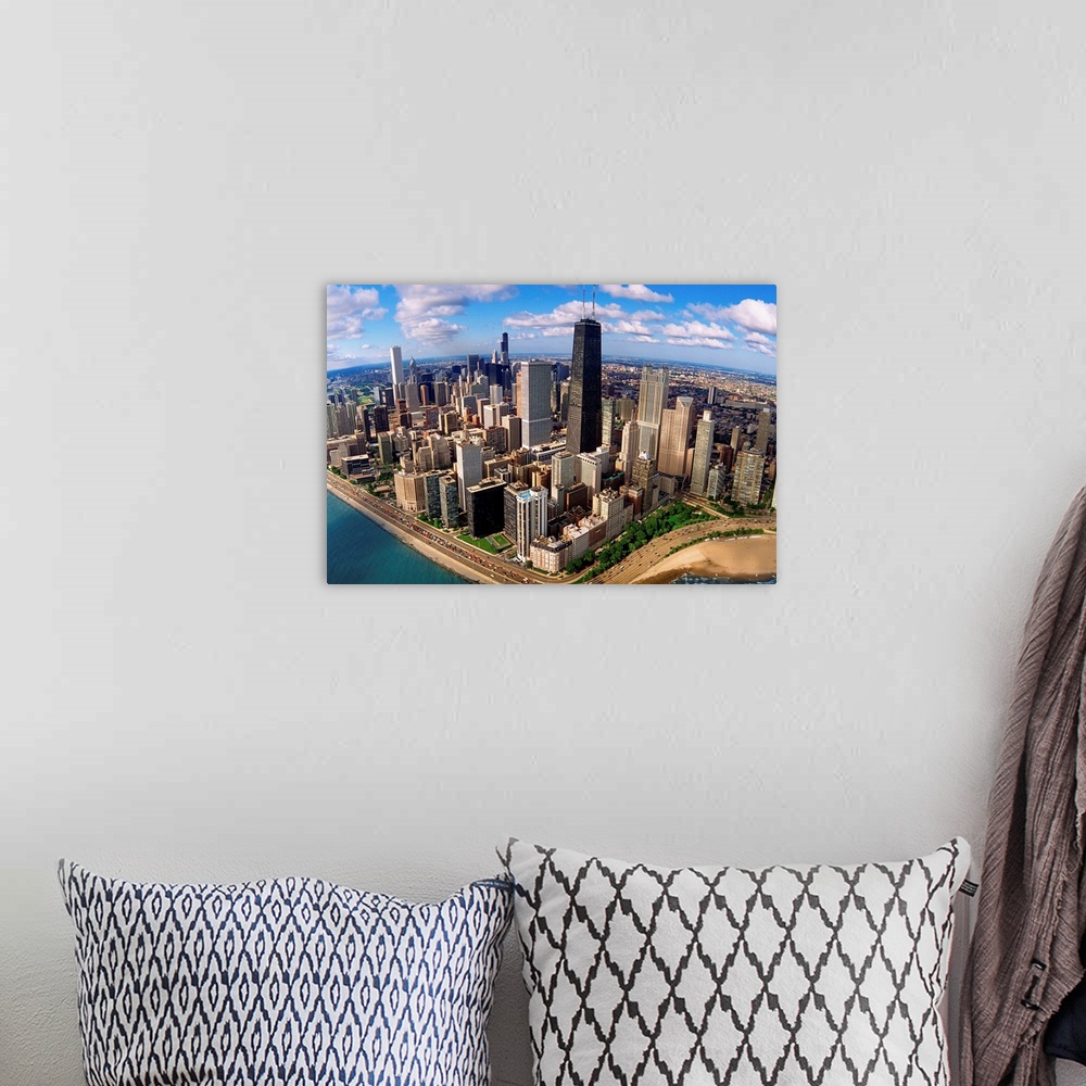 A bohemian room featuring A high angle landscape photograph viewing downtown Chicago taken from over Lake Michigan.