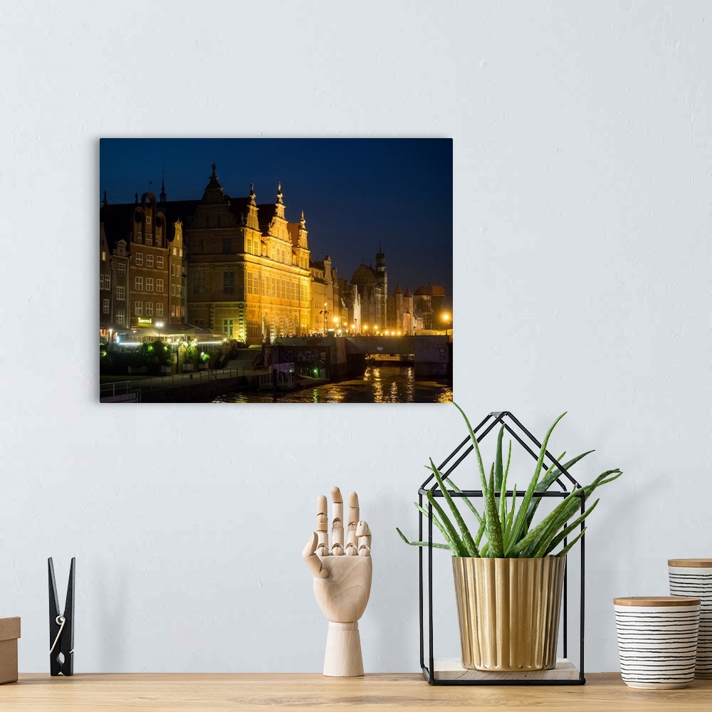 A bohemian room featuring City gate at the waterfront during night, Green Gate, Motlawa River, Gdansk, Poland