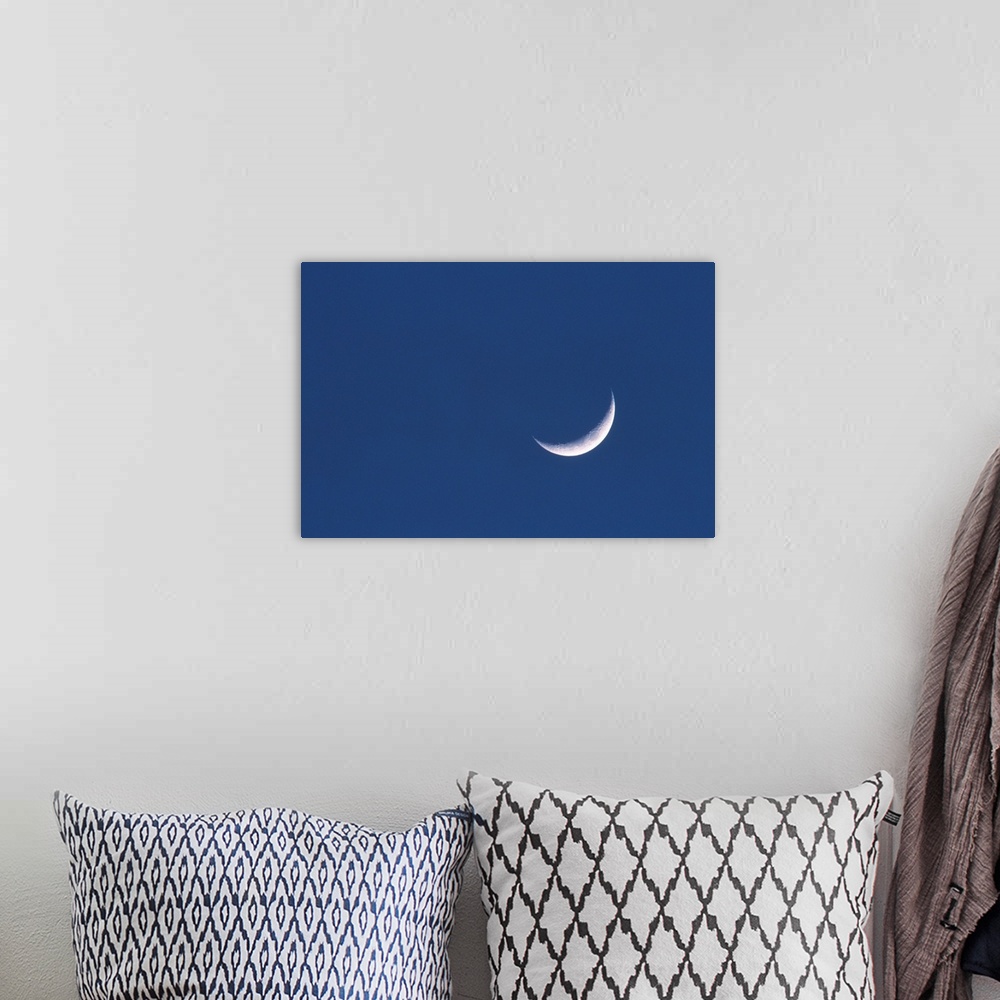 A bohemian room featuring Crescent moon in deep blue sky