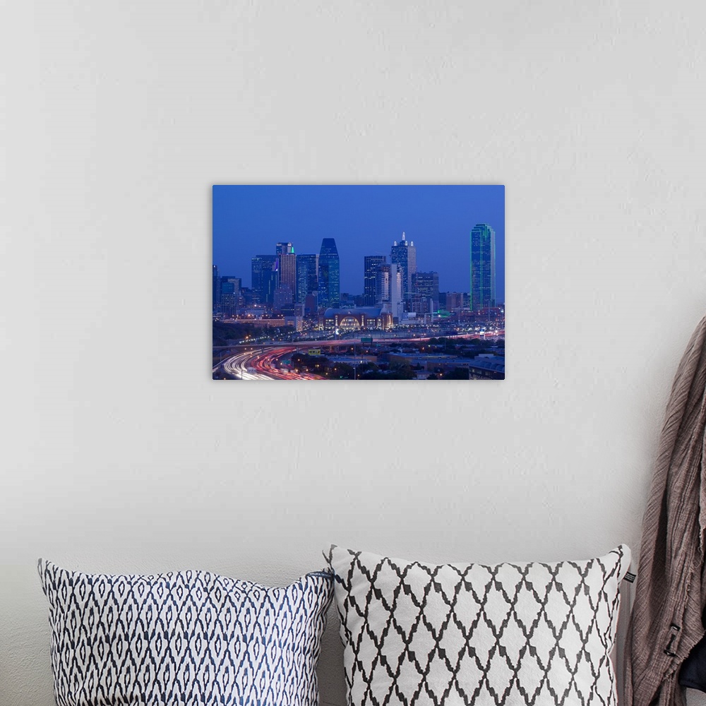 A bohemian room featuring Big photograph of downtown Dallas, Texas (TX) at night with a busy road in the foreground in fron...