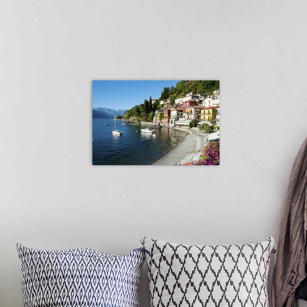 A bohemian room featuring Houses at waterfront with boats on Lake Como, Varenna, Lombardy, Italy