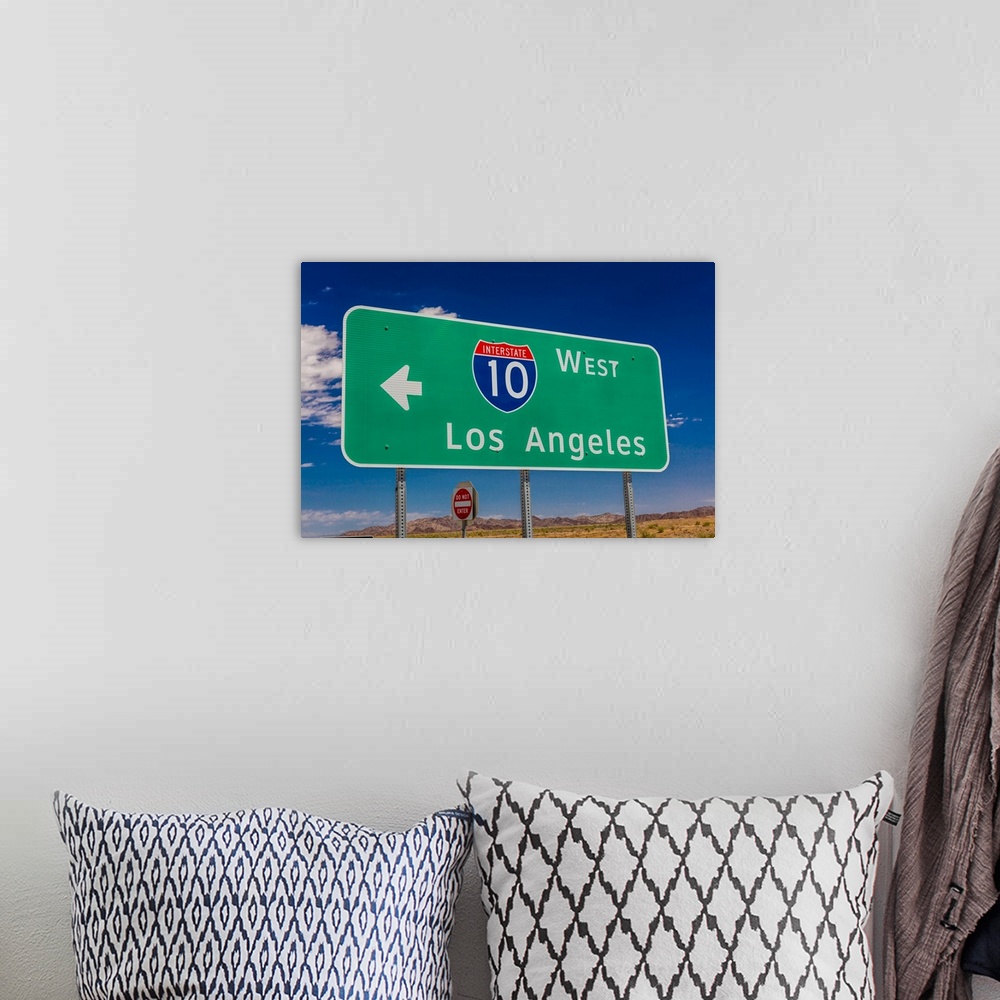 A bohemian room featuring Interstate 10 highway signs to and from phoenix,arizona and los angeles, california.