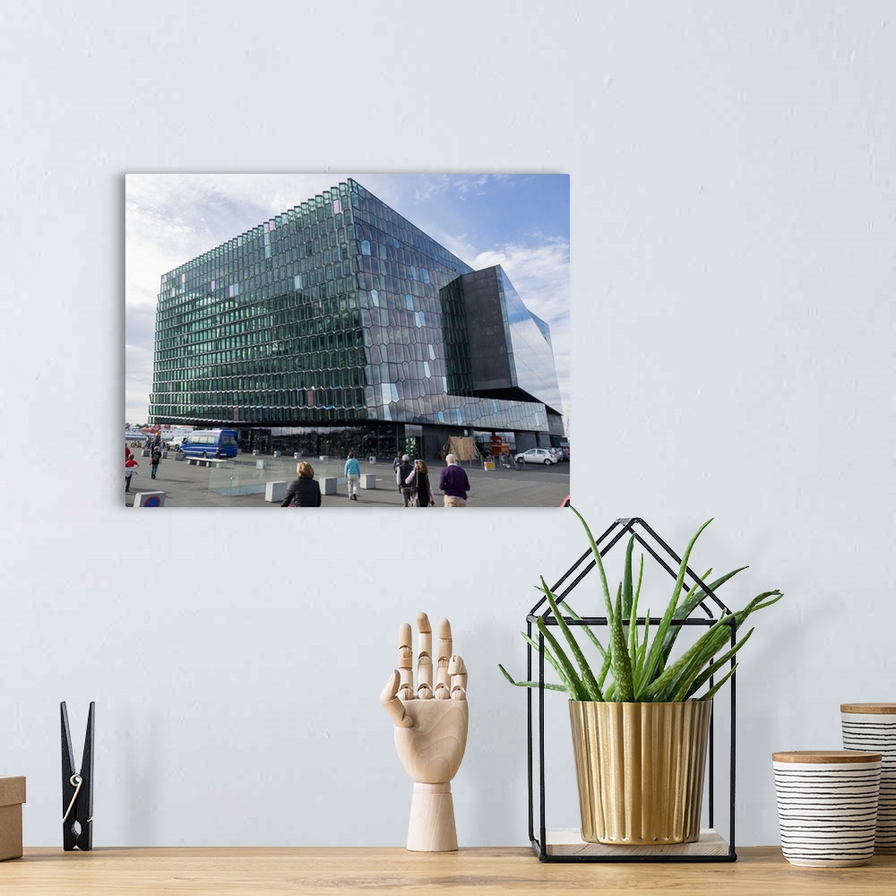 A bohemian room featuring Modern cube glass building against cloudy sky, Harpa Concert Hall, Reykjavik, Iceland