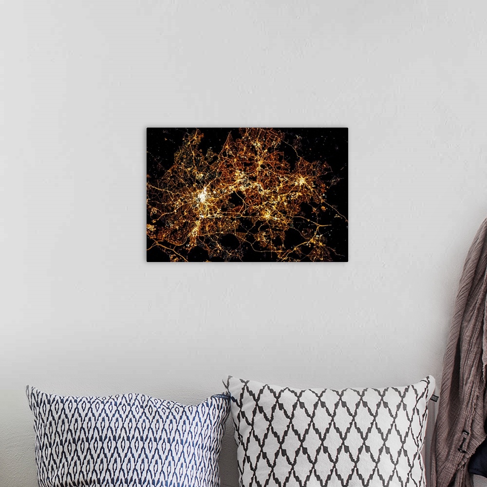 A bohemian room featuring Night time satellite image of a city in England, United Kingdom
