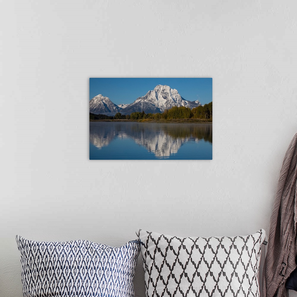 A bohemian room featuring Reflection of mountain and trees on water, Teton Range, Grand Teton National Park, Wyoming, USA