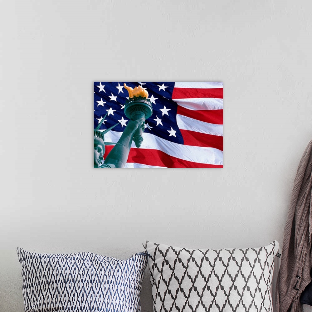 A bohemian room featuring Large, landscape photograph of the American Flag, the face of the Statue of Liberty in the bottom...