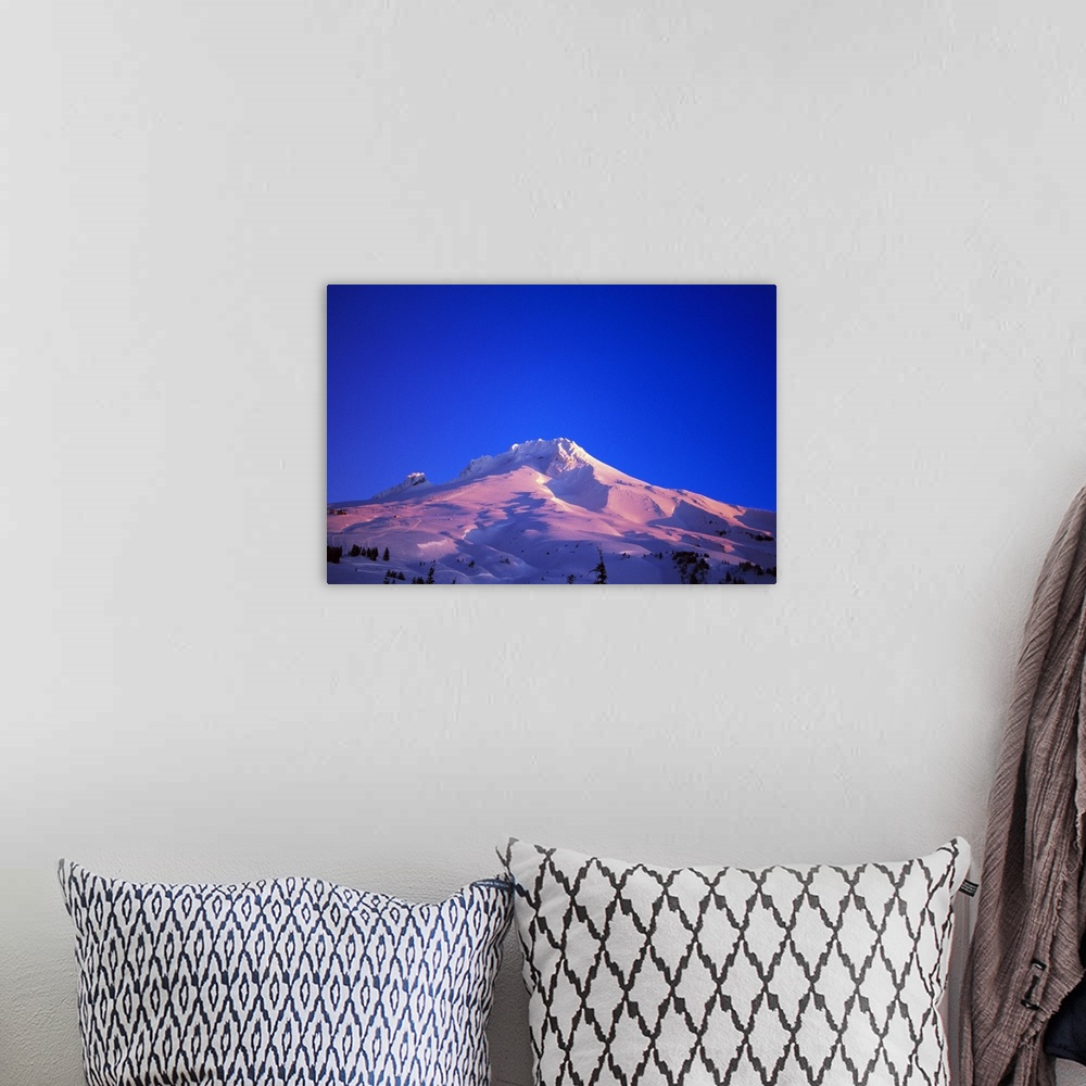 A bohemian room featuring Sunrise light on snowy Mount Hood, clear blue sky, Oregon, united states,