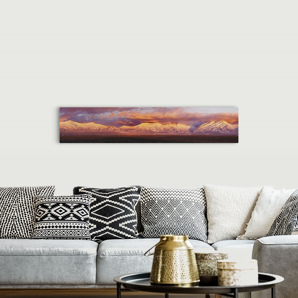 A bohemian room featuring Sunset over mountain range, Sangre De Cristo Mountains, Taos County, New Mexico
