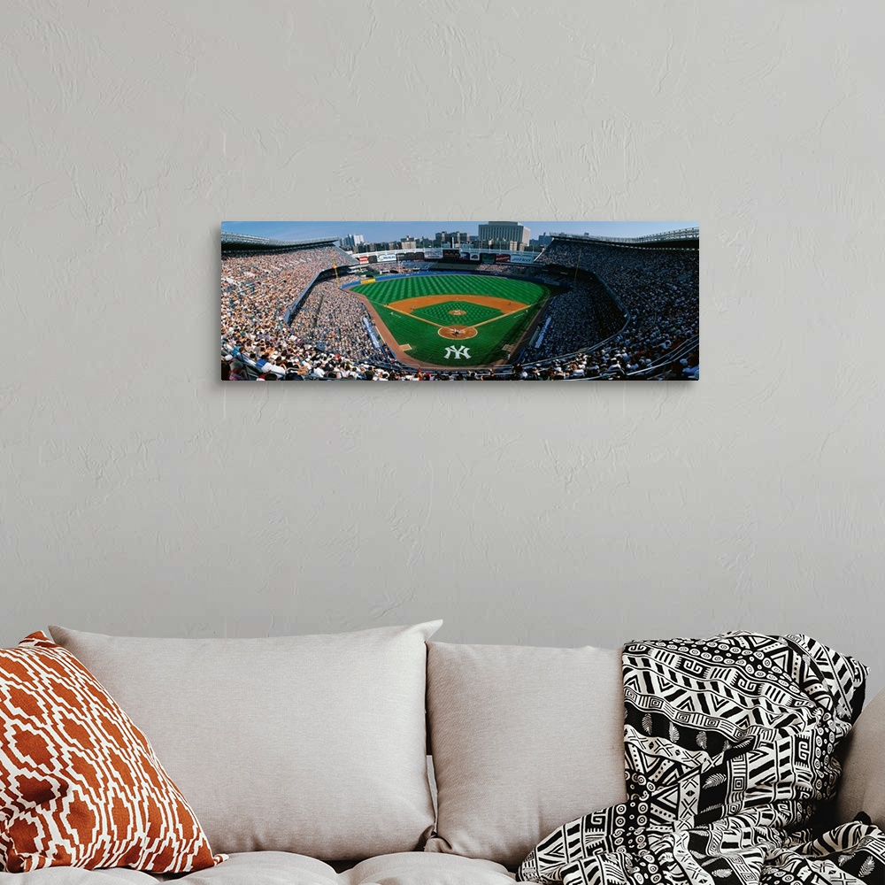 A bohemian room featuring Panoramic photograph taken at Yankee Stadium in the Bronx, New York displays fans enjoying a base...