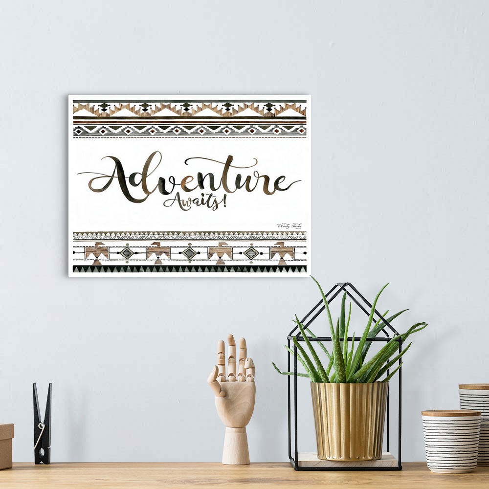A bohemian room featuring Decorative artwork featuring geometric southwestern designs and the words: Adventure Awaits!