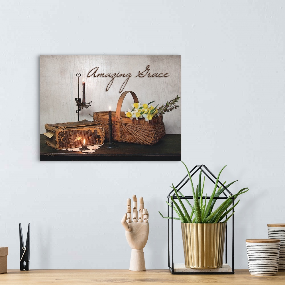 A bohemian room featuring This still-life photograph features rustic elements with the words, Amazing Grace, above it.