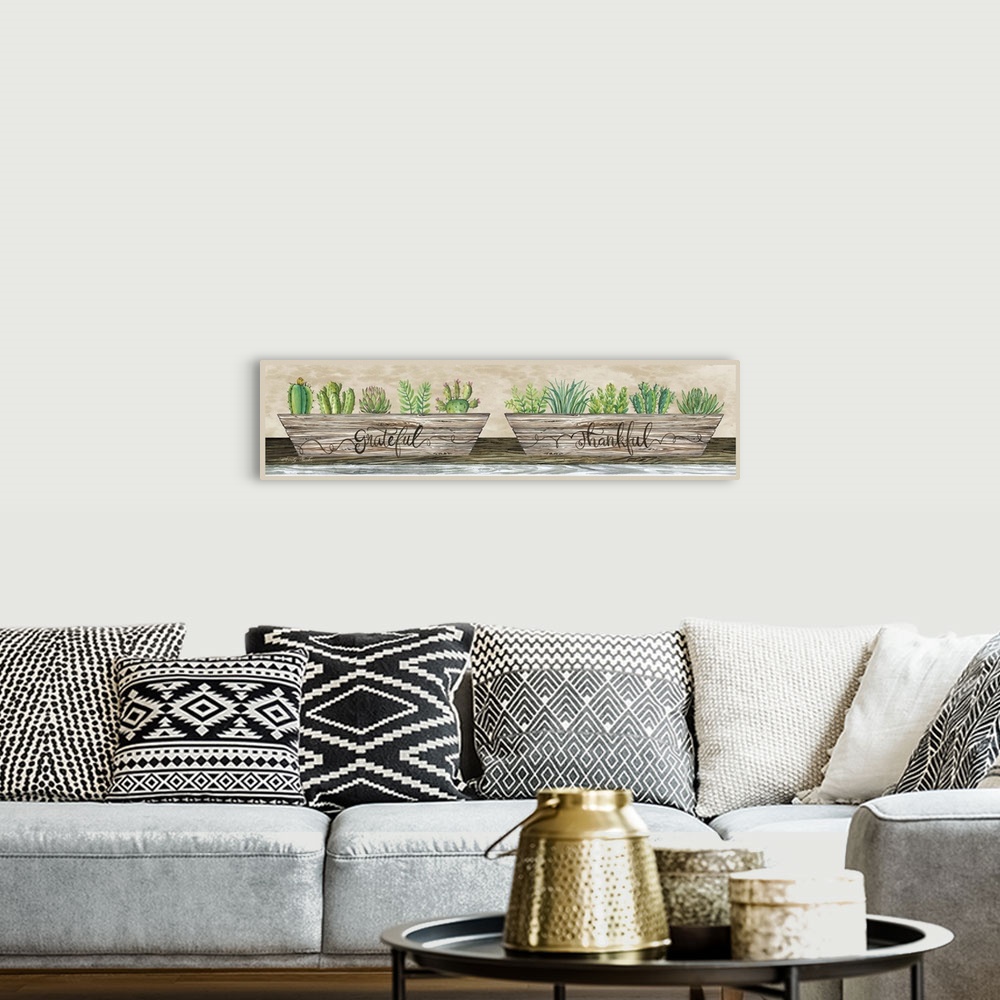 A bohemian room featuring Decorative artwork featuring planters filled with succulents and cacti.