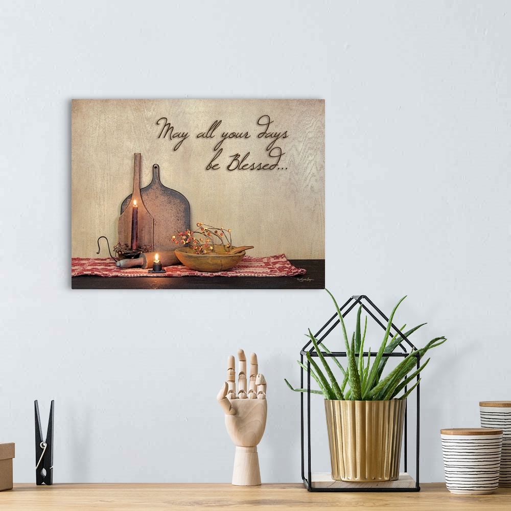 A bohemian room featuring This still-life photograph features rustic elements with the words, May all your days be blessed,...